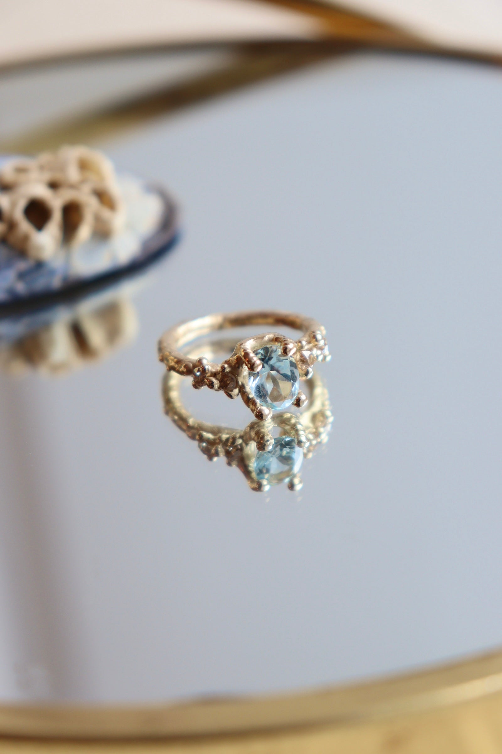 Aquamarine and Champaign antique diamond set in 14ct gold organically textured alternative engagement ring. 