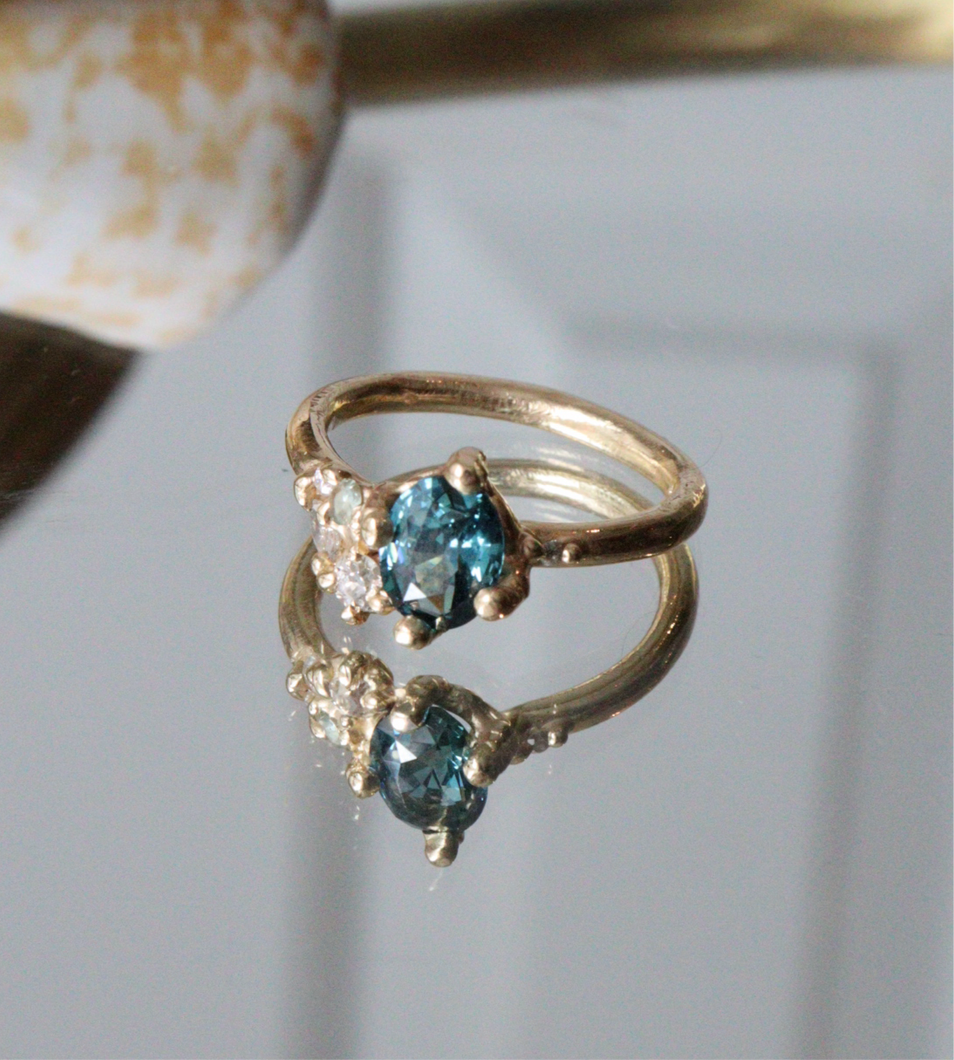 Teal Blue sapphire and diamond engagement ring