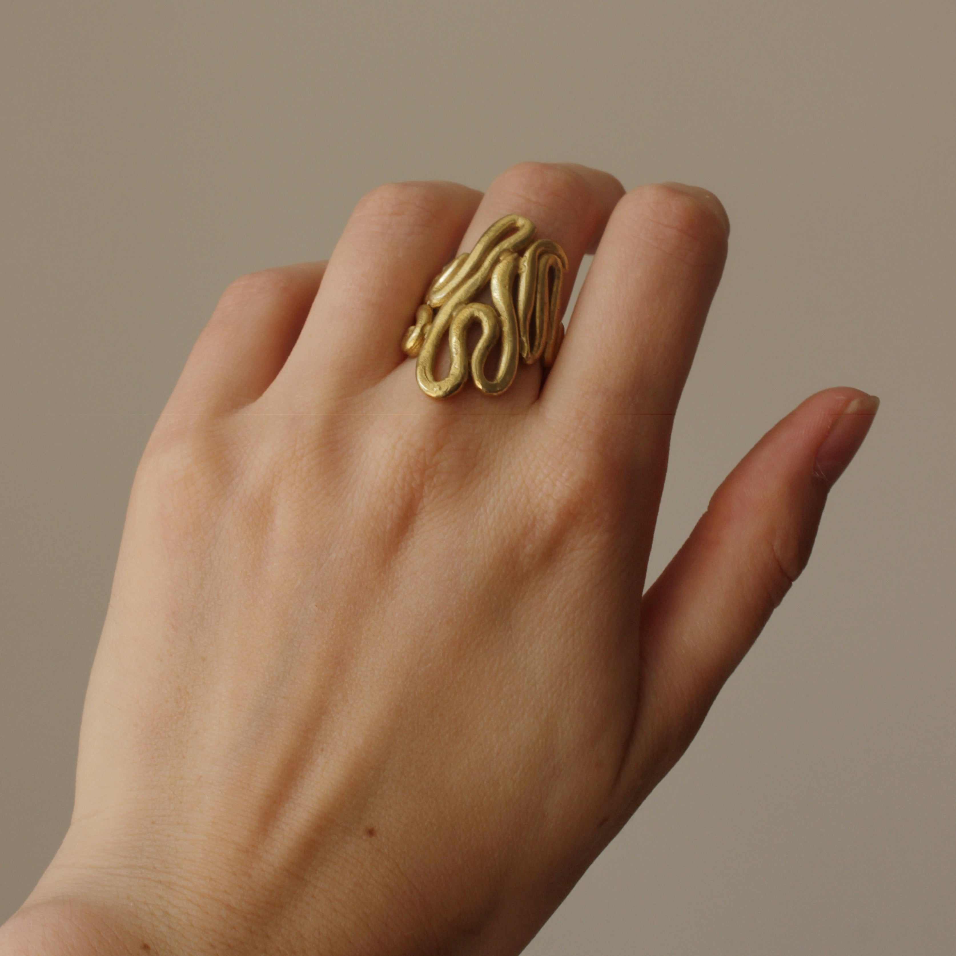 The one-of-a-kind Medusa ring has been handcrafted in  brass, detailing fingerprints and intricate twists and turns. Inspired by Medusa, the figure from Greek mythology and acting as a symbol to ward off evil and negativity.