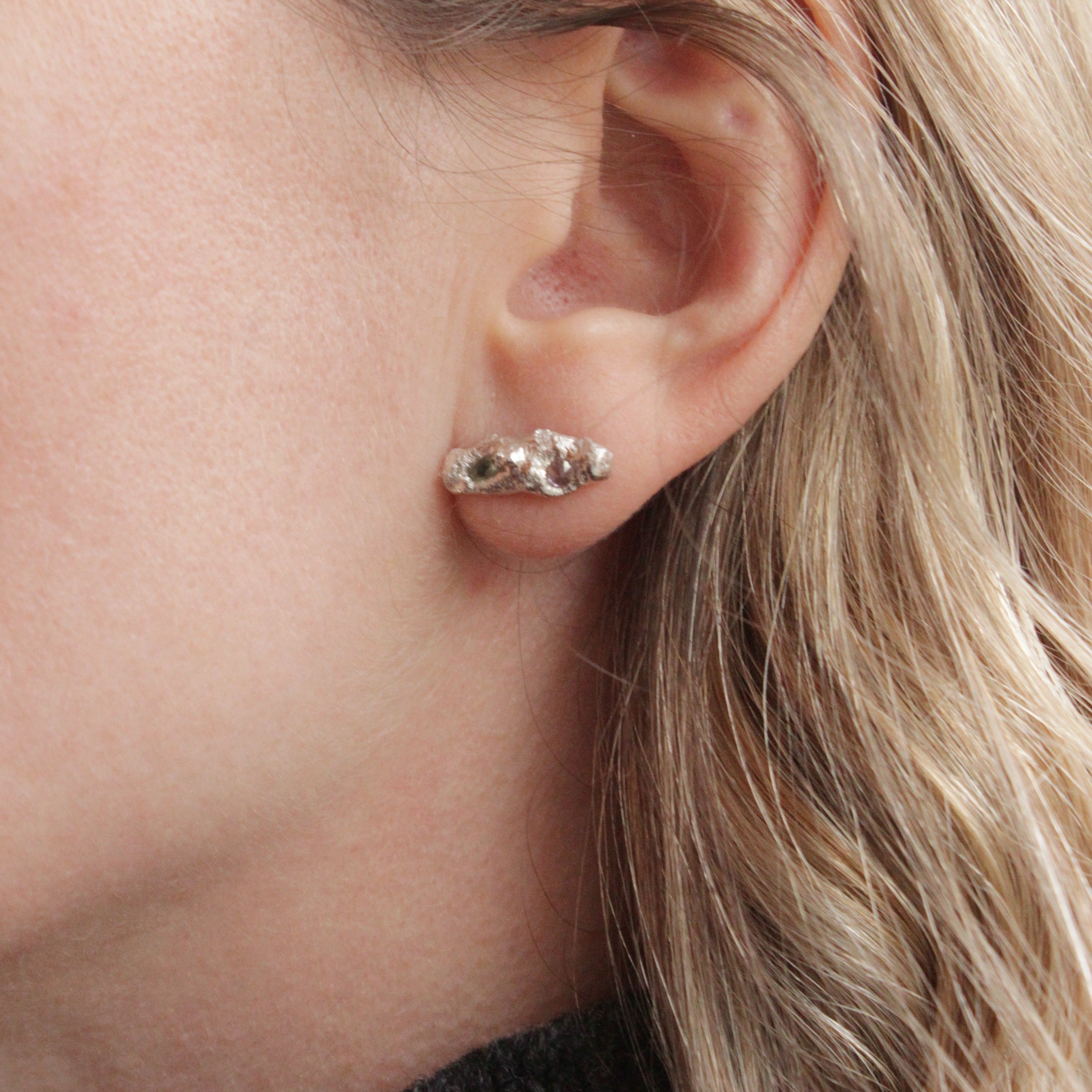 If you're looking for a timeless pair of studs to enjoy everyday, then these are perfect! These Sapphire nuggets feature one pink and green sapphire in each earring and an organic, unearthed texture.