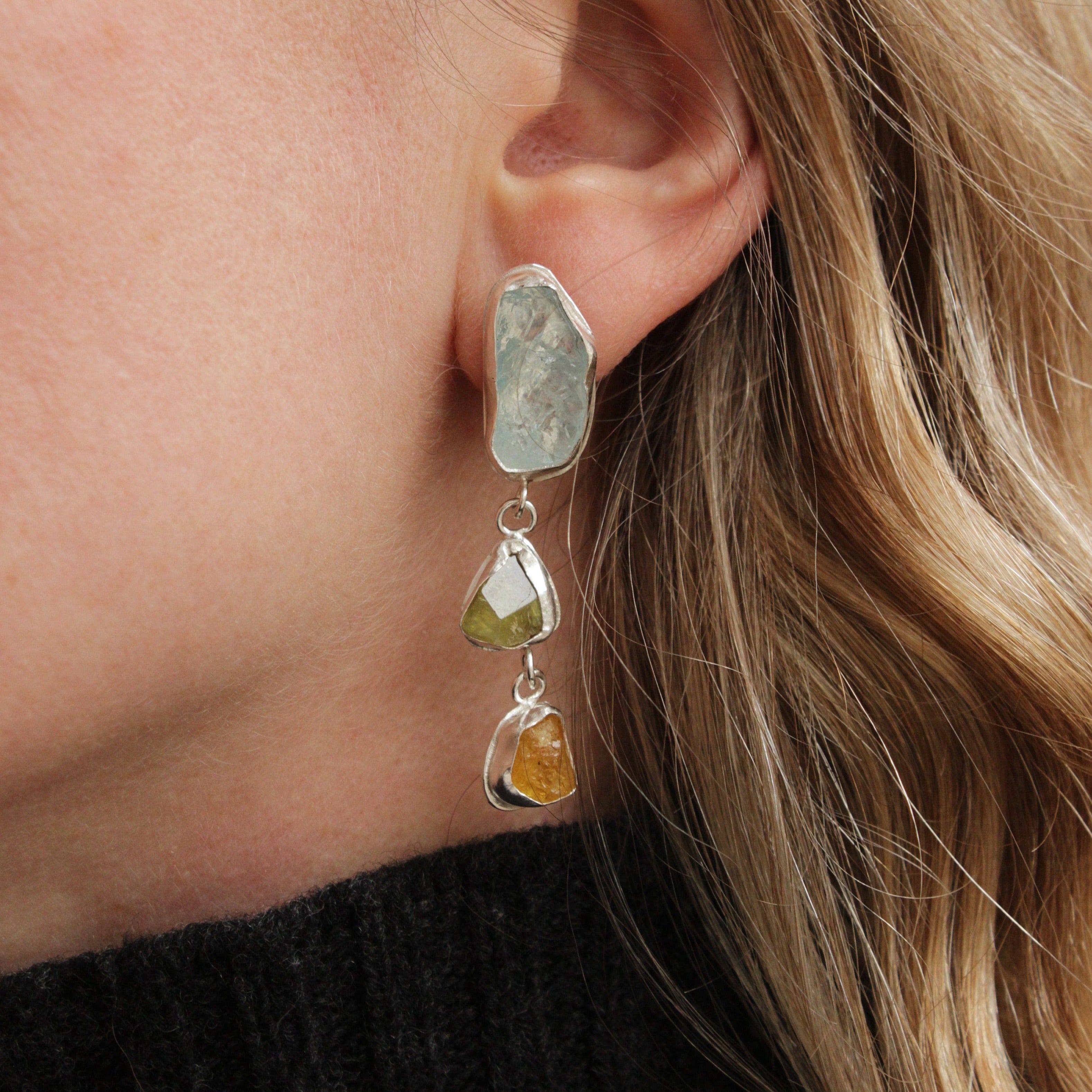 These stunning, one-of-a-kind earrings feature raw Aquamarine, Sphene and Golden Beryl stones. Each one encourages protection, abundance and promotes a healthy life.