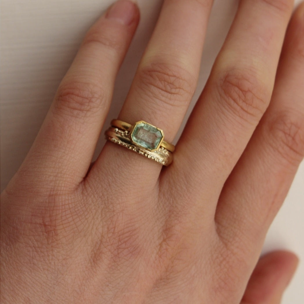 18 ct gold, stunningly vibrant emerald engagement ring, made for the minimalist bride. Hand crafted by Josie Mitchell jewellery in her Frome studio.