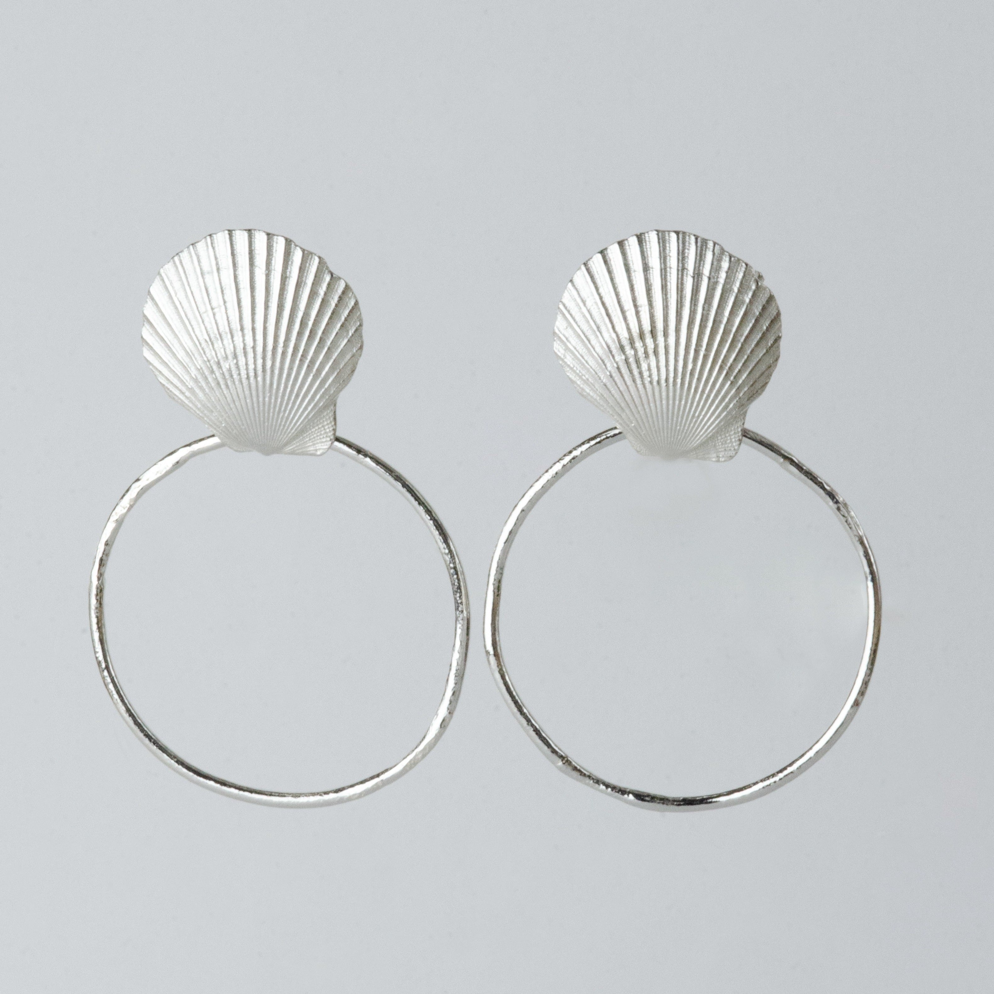 The Shell studs and hoops are versatile and perfect for any occasion. Created using the ancient form of lost wax casting, these earrings are an exact replica of a shell foraged from Bournemouth beach. Enjoy these oceanic treasures as studs, or easily attach the organically textured hoops for more of a statement.