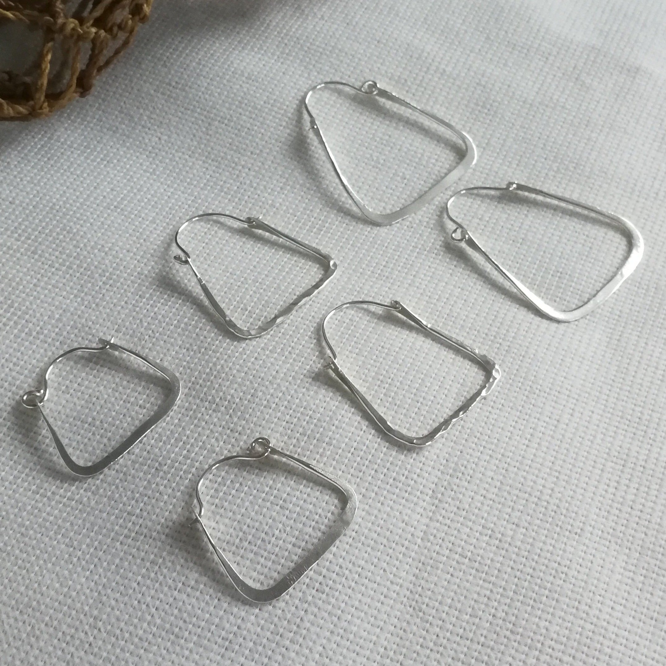 The Rectangle hoops are one of the first ever Josie Mitchell jewellery creations and are widely known for their comfort and movement. Customise your earrings to suit your personal taste with a selection of three different sizes and textures. Each one is mindfully hand crafted by Josie Mitchell Jewellery in her Bournemouth studio using sustainable recycled sterling silver.