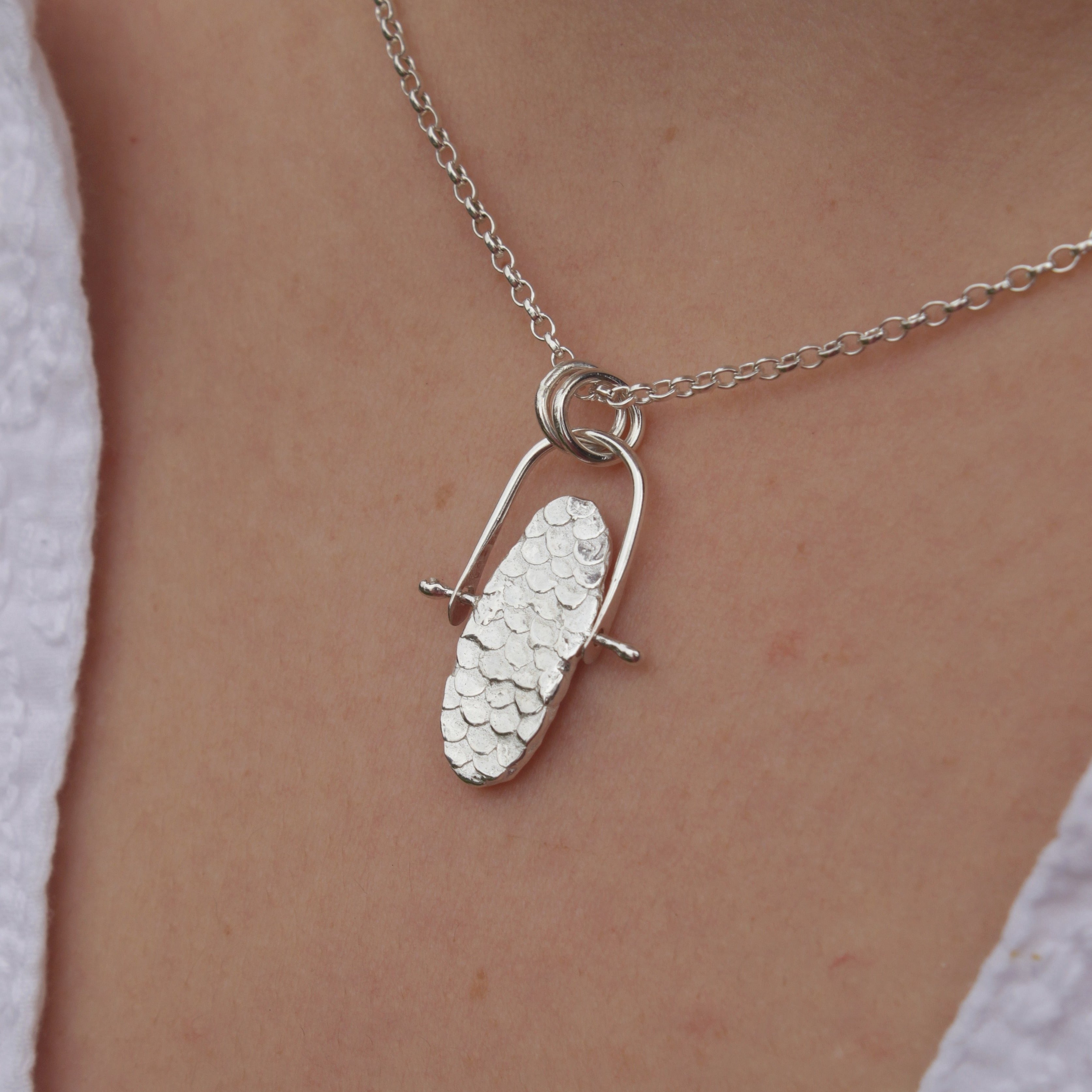 The Infinity pendant is everything you’ll ever need in a necklace. It features the signature Siren scales, organic textures and playfully tactile movement-making it the perfect antidote for anxiety and stress. Roll the pendant around in your fingers through times of stress and enjoy the calming benefits it brings.