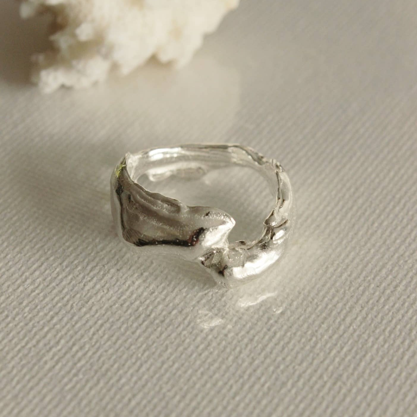 The molten ring appears to have been moulded from the ocean itself. Inspired by molten lava spilling into cool water to create organic and unique sculptures. Enjoy this treasure wrapped around your finger everyday and feel a little closer to the ocean.