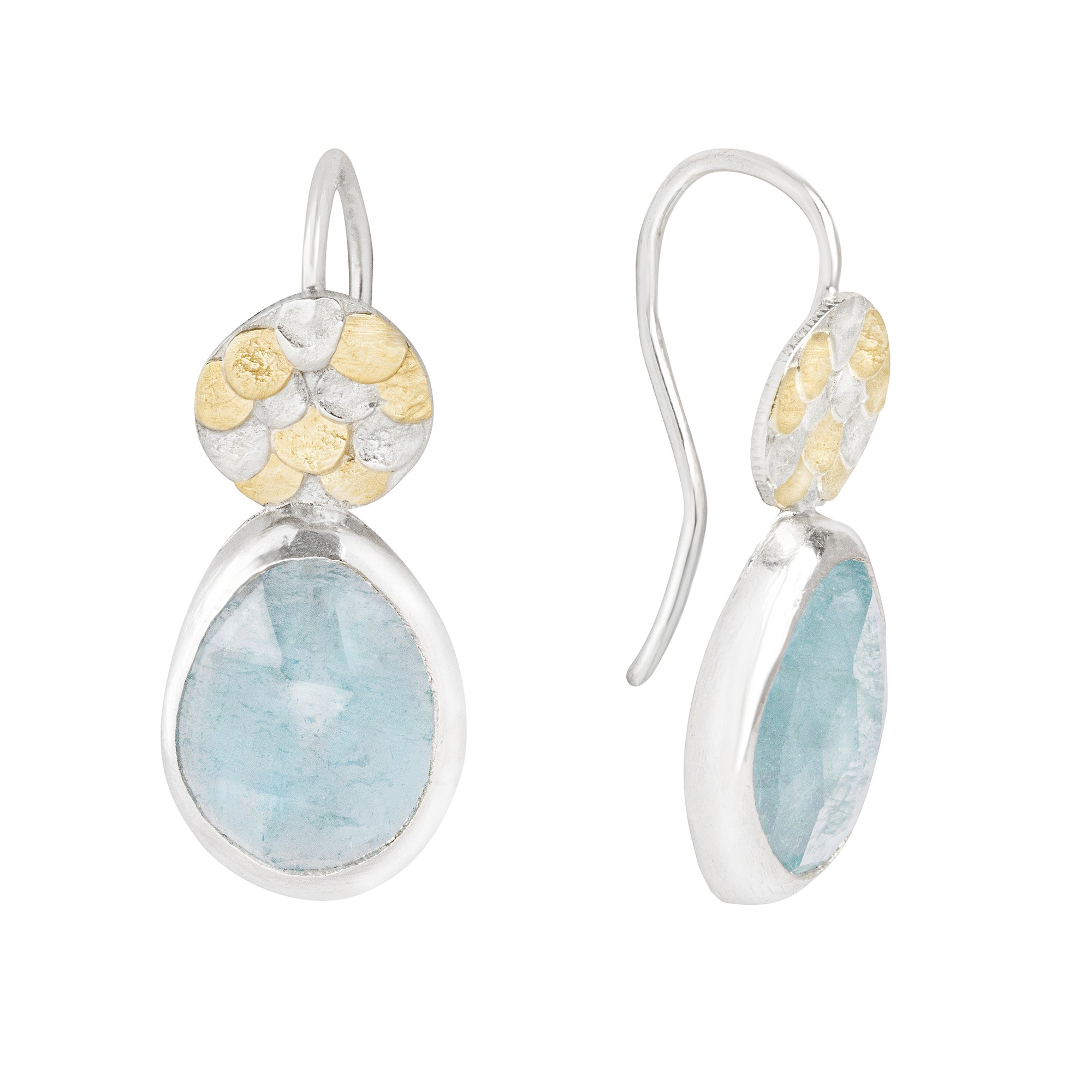 The handcrafted Aquamarine Siren drop earrings by Josie Mitchell Jewellery are one-of-a-kind and completely unique. The vibrant Aquamarines are full of magic and remind us of crystal clear Mediterranean waters. The earrings include Josie's signature Siren scale detailing at the top for the most magical pair of earrings..