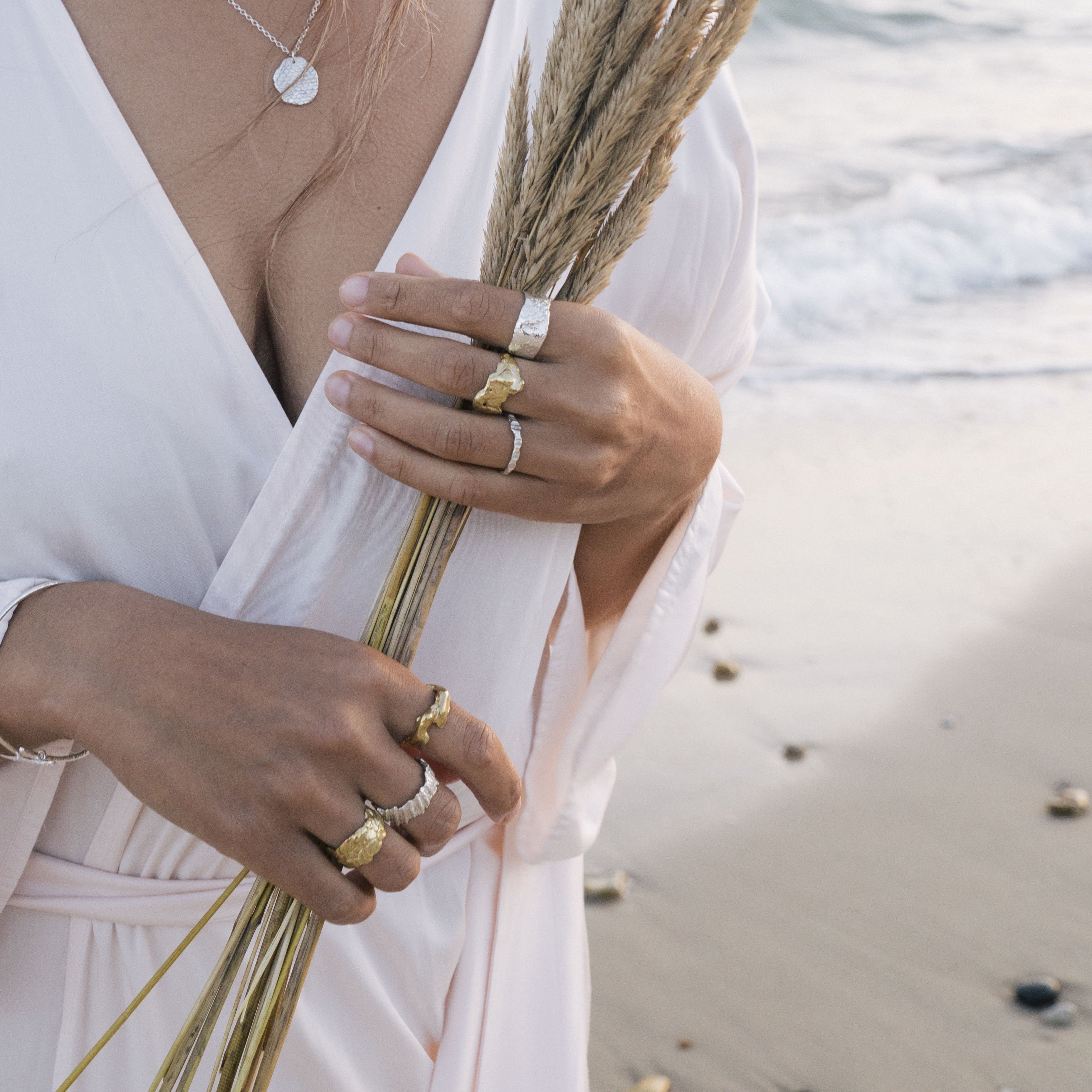 The Molten ring appears to have been moulded from the ocean itself. Inspired by molten lava spilling into cool water to create organic and unique sculptures, reminding us of the power of mother nature. Enjoy this treasure wrapped around your finger everyday and feel a little closer to the ocean.