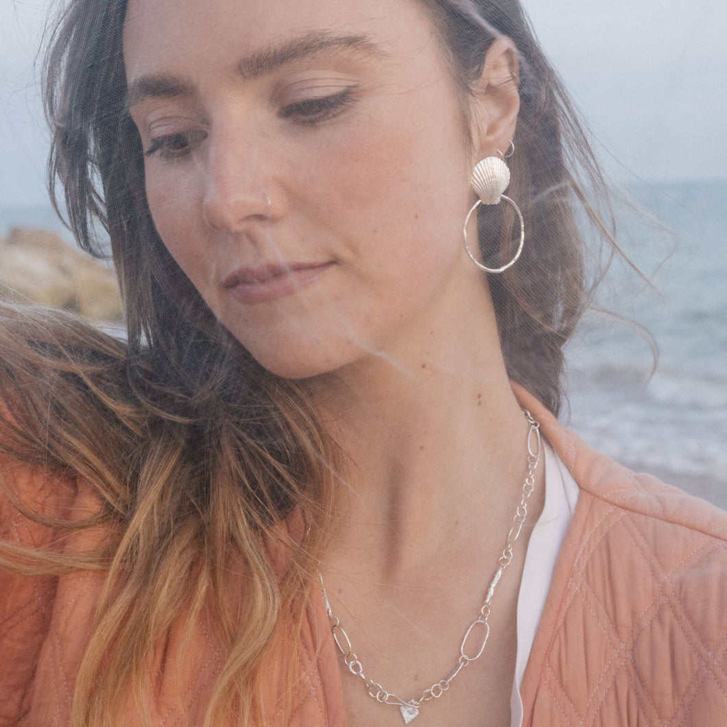 The Shell studs and hoops are versatile and perfect for any occasion. Created using the ancient form of lost wax casting, these earrings are an exact replica of a shell foraged from Bournemouth beach. Enjoy these oceanic treasures as studs, or easily attach the organically textured hoops for more of a statement. 