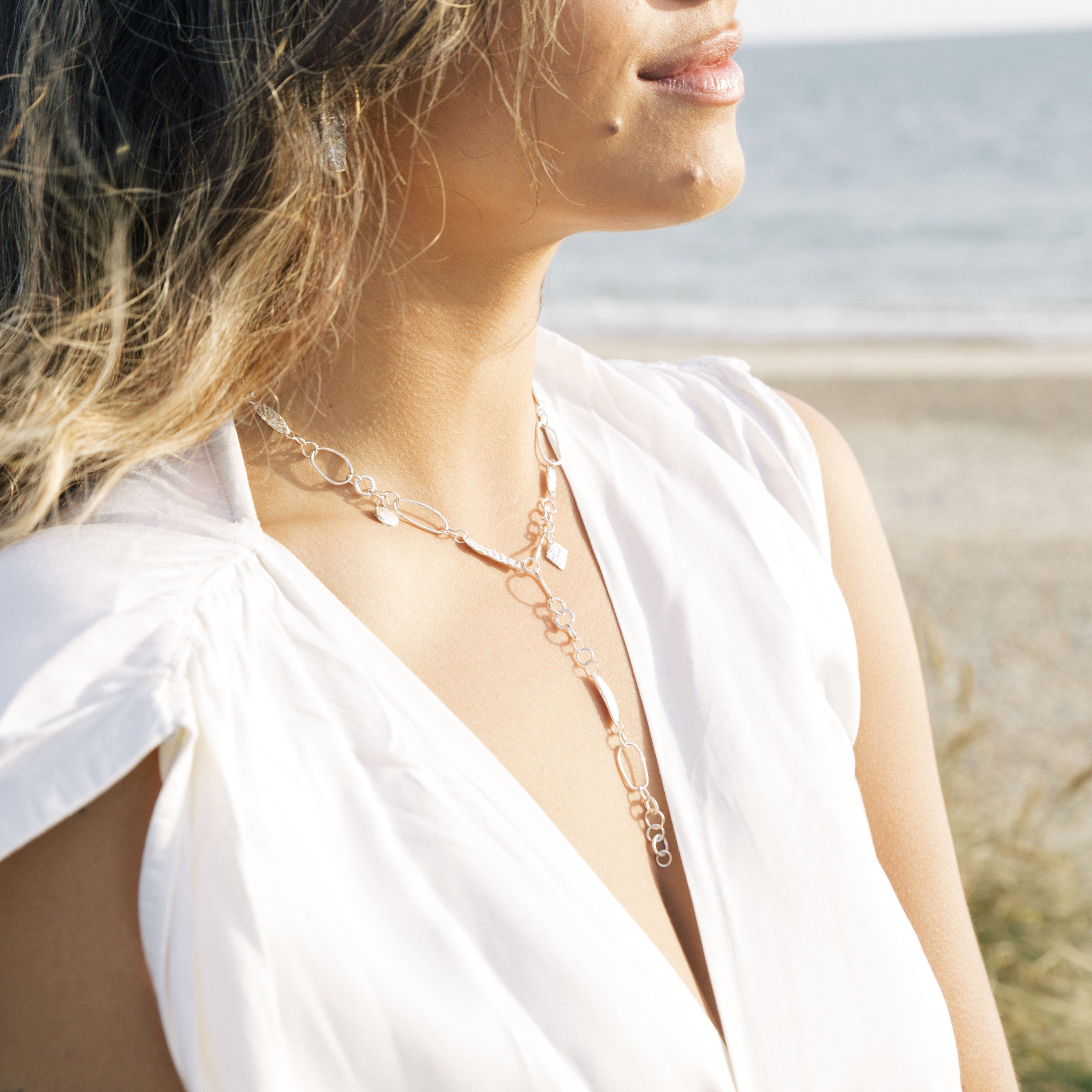 Versatile and stunning, the Wild Thing two-in-one piece was designed to be worn for any occasion, and full of tactile, timeless treasures, unique and different in each piece. Explore the intricate and unique details of this piece with every handcrafted link, Siren charm, and shell imprint. Wear this piece as a necklace, or wrapped around your wrist or ankle. Enjoy the versatility and endless possibilities this treasure brings.