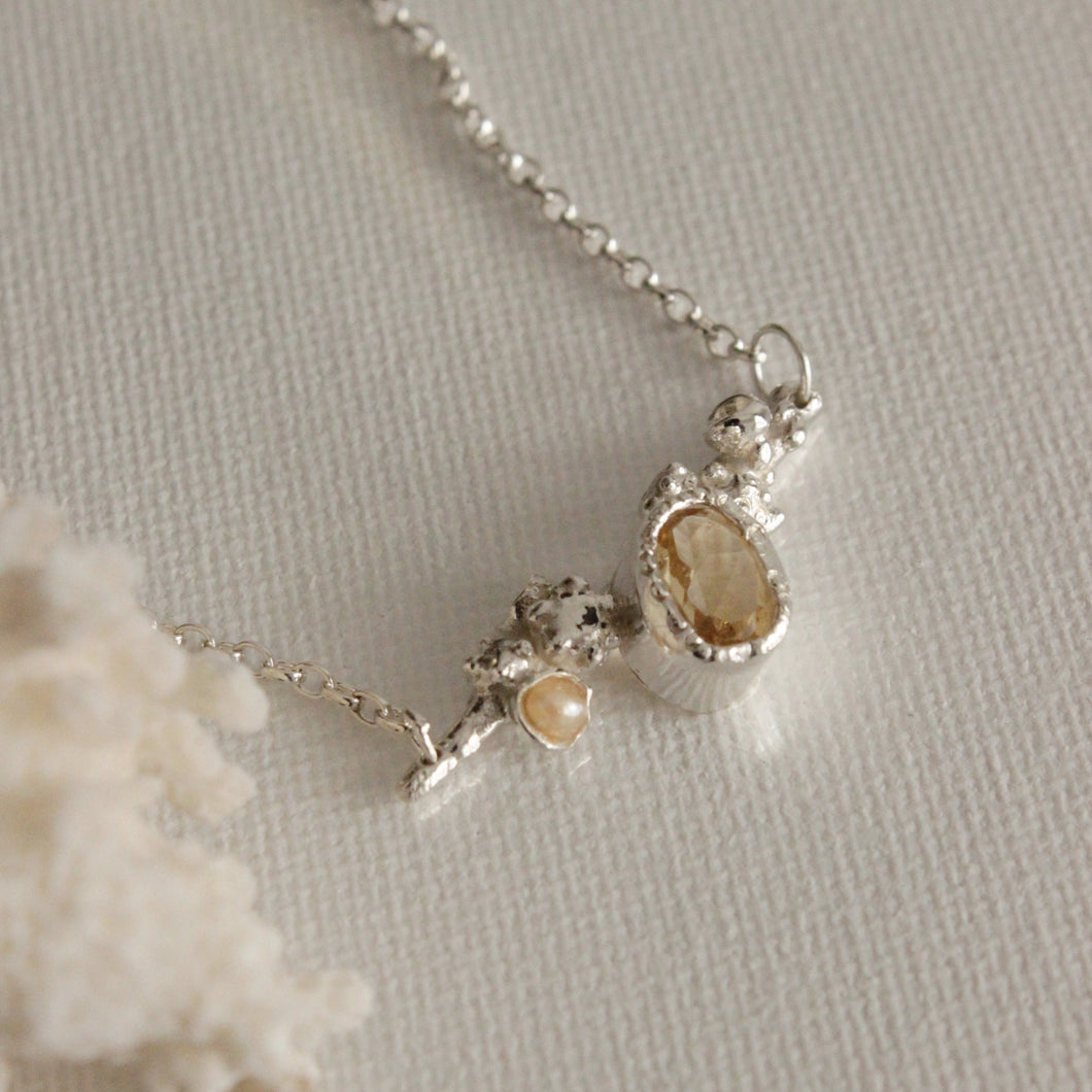 The Citrine Cluster pendant appears to have been plucked from the depths of the ocean, featuring an warm honeycomb Citrine stone surrounded by cluster formations and delicate details. This treasure would make a beautiful everyday staple and layers beautifully with other JM Jewellery necklaces.